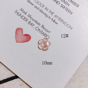 Detail of 10mm pink flower shell charm with center hole for DIY jewelry making