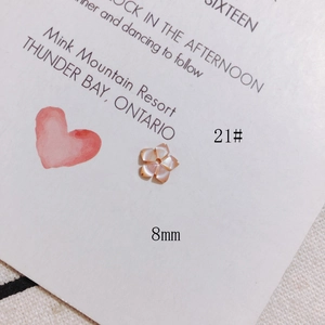 Close-up of 8mm pink shell flower charm with center hole for DIY jewelry making
