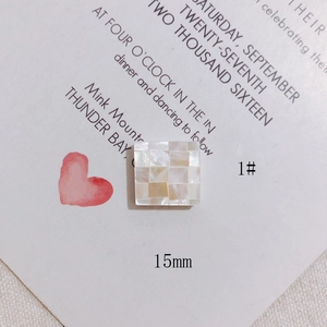 Macro view of 15mm square shell mosaic charm with iridescent mother of pearl texture