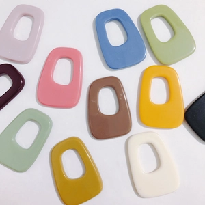 Close-up of irregular hollow acrylic charms in vibrant candy colors for DIY jewelry making