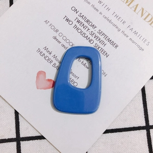 Close-up of blue geometric hollow resin acrylic pendant for DIY jewelry making