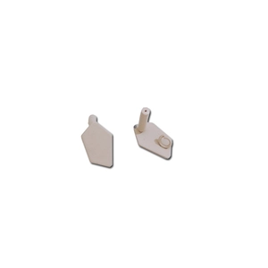 Close-up of irregular geometric alloy earring studs with matte cream painted finish