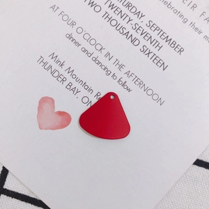 Macro detail of red fan-shaped matte alloy earring charm for DIY jewelry making