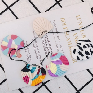 Handmade abstract colorful fan-shaped resin charms set with zebra and pastel patterns