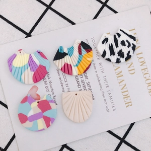 Handmade abstract fan-shaped earrings with colorful patterns and artistic textures