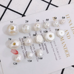 Assorted DIY pearl beads for jewelry making in various shapes with iridescent luster finish