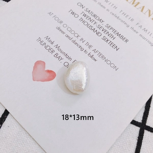 Detail view of a 18x13mm baroque pearl bead with iridescent velvet texture and high luster
