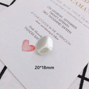 Macro view of a 20x18mm irregular baroque pearl with iridescent pearlescent finish