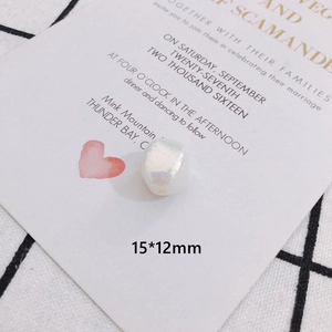 Macro view of a 15x12mm baroque pearl with iridescent luster and natural texture