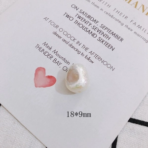 Detailed macro view of 18x9mm iridescent baroque pearl with natural wrinkled texture