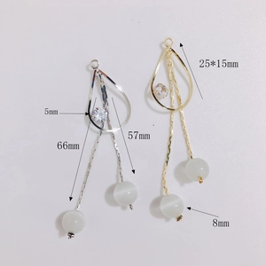 Boucles d'oreilles longues à pampilles avec œil de chat et zircons cubiques
