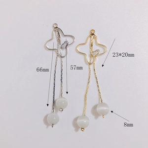 Vue détaillée de boucles d'oreilles DIY à pampilles avec perles œil de chat et zircon