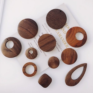 Macro view of geometric wooden earring charms for DIY jewelry making in dark walnut finish