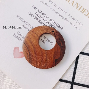 Detail view of 44.5mm coffee brown geometric wooden round pendant for DIY earring making