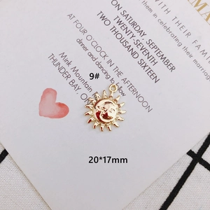 Detailed view of gold sun and moon jewelry pendant with precise 20x17mm dimensions