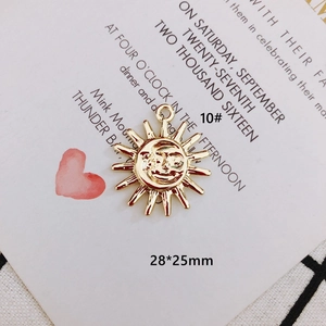 Detailed view of a 28x25mm sun and moon gold plated pendant for DIY jewelry making