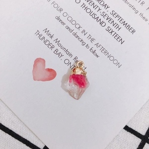 Macro detail of a pink translucent crystal pendant with a hammered gold metal cap for DIY