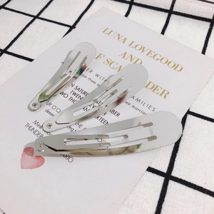 Three minimalist silver teardrop BB hair clips set on a stylish decorative card