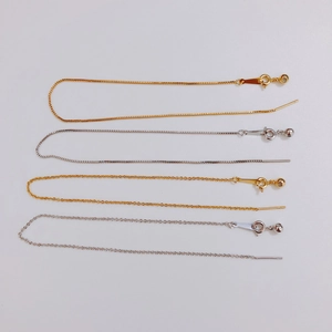 Detail of adjustable gold and silver plated O-link chains with spring ring clasp for DIY