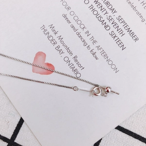 Close-up of adjustable 925 silver box chain bracelet with sliding bead and spring clasp