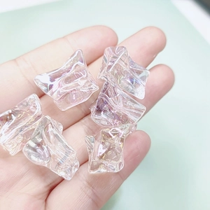 Macro view of iridescent irregular resin beads for DIY earring and jewelry making