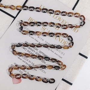 Detailed view of amber and clear acetate link chain for DIY eyewear and jewelry accessories