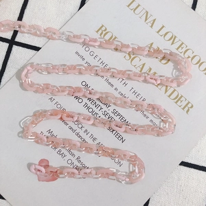 Pink and clear acetate acrylic link chain with heart pendant on vintage card