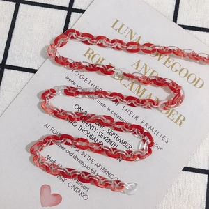 Macro view of marbled red and clear acetate link chain for DIY accessory projects