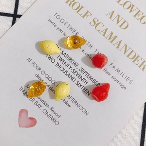 DIY fruit beads set with red strawberries and yellow lemons for handmade jewelry making