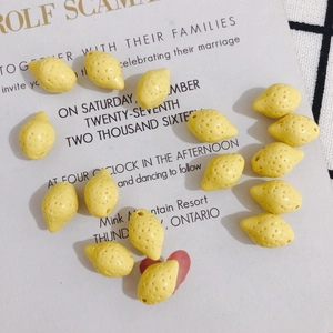 Detailed view of yellow mini lemon beads with side holes for DIY jewelry making