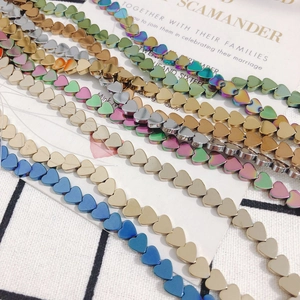 Flat heart-shaped hematite beads in blue, gold, and silver for DIY jewelry making