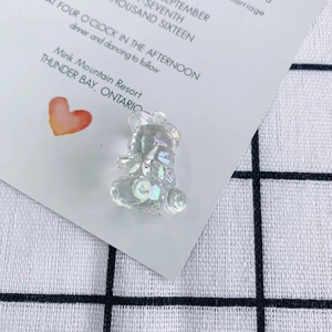 Macro view of iridescent transparent bear charms for DIY jewelry and accessories