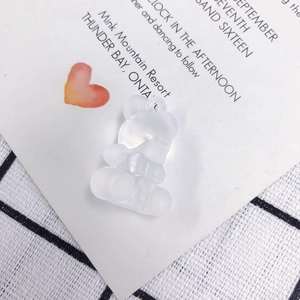 Detailed close-up of a frosted translucent bear pendant with a pre-drilled hanging hole