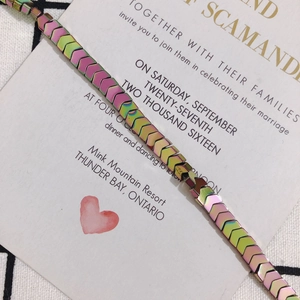 Detailed shot of chevron arrow link bracelet with iridescent rainbow metallic finish