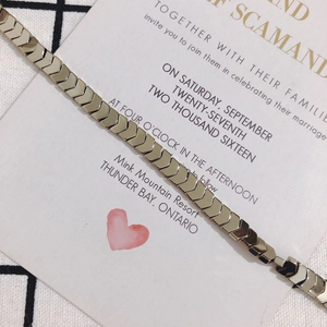 Detailed view of gold arrow-shaped metal beads chain for DIY jewelry making