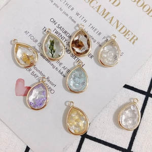 Eight teardrop floral resin pendants with gold copper plating for DIY jewelry