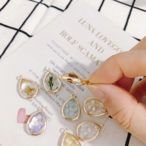 Water-drop shaped resin pendants with dried flowers and gold plating for DIY jewelry