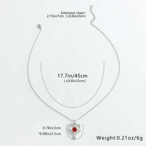 Detailed view of heart birthstone necklace with dimensions 2cm by 2.5cm and red zircon
