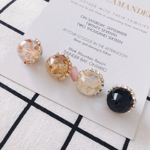 Close-up of alloy round crystal beads with gold serrated metal base for DIY jewelry