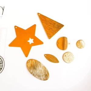 DIY gold plated geometric metal pendants in various shapes with a brushed texture finish