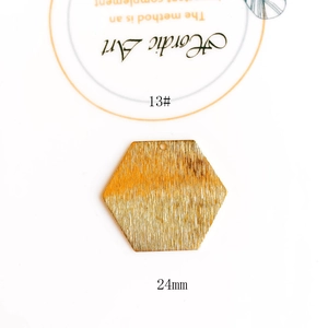 Detailed macro view of 24mm gold brushed hexagon pendant for DIY jewelry making