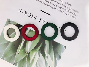 DIY colorful geometric matte wooden rings in ivory, red, dark green and black colors