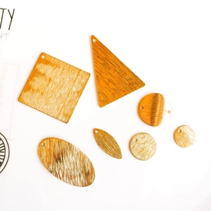 Brushed gold geometric pendants in square and leaf shapes for DIY jewelry making
