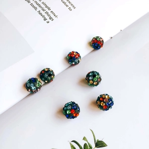 Close-up of colorful rhinestone sphere beads for DIY earring and jewelry making