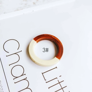 Detail view of round 3# DIY earring component showing wood and resin patchwork texture