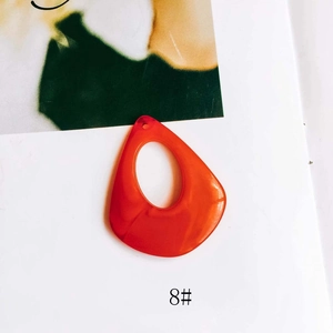 Macro shot of an orange teardrop resin pendant for DIY jewelry earring making, item 8#