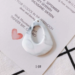 Detail of marble pattern resin teardrop pendant for DIY jewelry making accessories