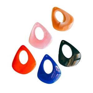 Five assorted resin teardrop charms in vibrant colors for DIY jewelry making sets
