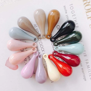 Polished resin teardrop pendants with holes for DIY jewelry making in multiple colors