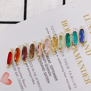 Colorful oval crystal connectors with gold alloy borders and double loops for DIY jewelry